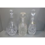 A Georgian ring neck decanter and two others.