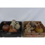 Two boxes of assorted native earthenware ewers and water carriers, including some with painted