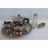 A silver backed brush, a silver topped sugar sifter, a silver thimble, a silver plated drinks tray