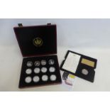 A cased Queen's Golden Jubilee silver proof 13 coin set with certificate of authenticity.