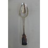 A silver serving spoon, London 1817 by William Bateman.