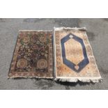 Two Eastern prayer rugs.