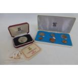 An Isle of Man 1971 decimal proof set and a Pobjoy Mint Isle of Man silver 25" commemorative