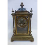 A 19th Century mantle clock of ornate form with cloisonne enamel pediment, above an enamel dial