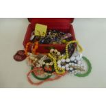 A jewellery box with an assortment of costume jewellery including 1950s.