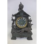 An unusual 19th Century bronzed spelter mantle clock of naturalistic form with ivy growing up one