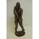 A bronze studio sculpture by Bryan Collins depicting a nude man and woman, titled "The Kiss", signed