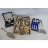 An assortment of mixed flatware including silver collared knives and forks plus a cased egg cup