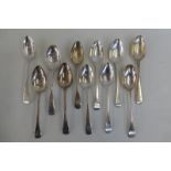 Eleven silver dessert spoons, mostly Georgian.