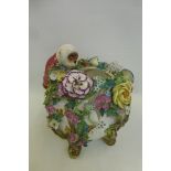 A Continental floral encrusted bowl with attached monkey, dressed in jacket and trousers, looking