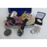 A box of assorted costume jewellery to include silver brooches etc.