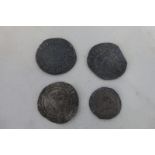 Four hammered coins comprising three pennies and a silver farthing.