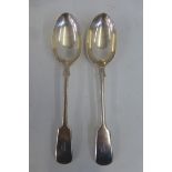 A pair of silver serving spoons, London 1908.