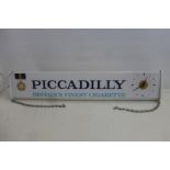 A Piccadilly 'Britain's Finest Cigarette' lightbox with integral clock to one end, 37 1/4 x 8 1/2