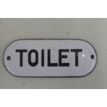 A domed enamel door plate sign for Toilet, 4 x 1 3/4".