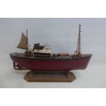 A scale model of a tug boat.