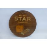 A Wills's Star Cigarettes pictorial packet tin advertising sign of circular form, 11 3/4" diameter.