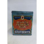 A Stotherts Blood and Stomach Pills square tin string dispenser.