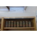 Nine Amery's Bath Oliver Biscuit cylindrical tins with original paper labels, each with a coat of