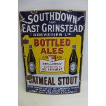 A rare Southdown and East Grinstead Breweries Limited Bottled Ales pictorial enamel sign, with