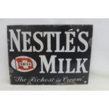 A Nestle's Milk 'The Richest in Cream' rectangular enamel sign, 24 x 18".