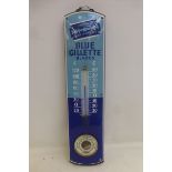 A Gillette Blue Blades two tone blue enamel thermometer with integral barometer, the sign in near