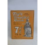 A Fry's Pure Soluble Breakfast Cocoa pictorial showcard depicting a lady beside an oversized can,