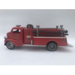 A first generation 'cab-over'- Tonka tinplate fire engine.