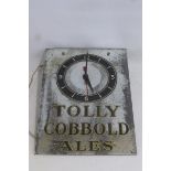 A mirrored glass rectangular advertising wall clock promoting Tolly Cobbold Ales, 11 1/2 x 16".