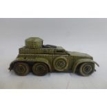 A clockwork tinplate model of a WWI armoured vehicle.