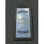 An Ogden's Guinea Gold Cigarettes advertising mirror, 13 1/2 x 27 1/2".