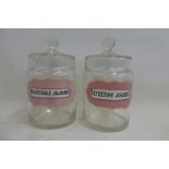 Two glass chemist jars with pink labels for Delectable Jujubes and Glycerine Jujubes.
