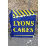 A Lyons Cakes double sided enamel sign of unusual design with "awning" to both sides, the sign in