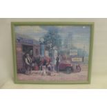 A framed and glazed puzzle depicting a circa. late 1930s/1940s village garage scene with early