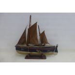 A small scale model of a boat.