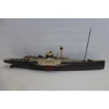 A scale model of a paddle steamer.