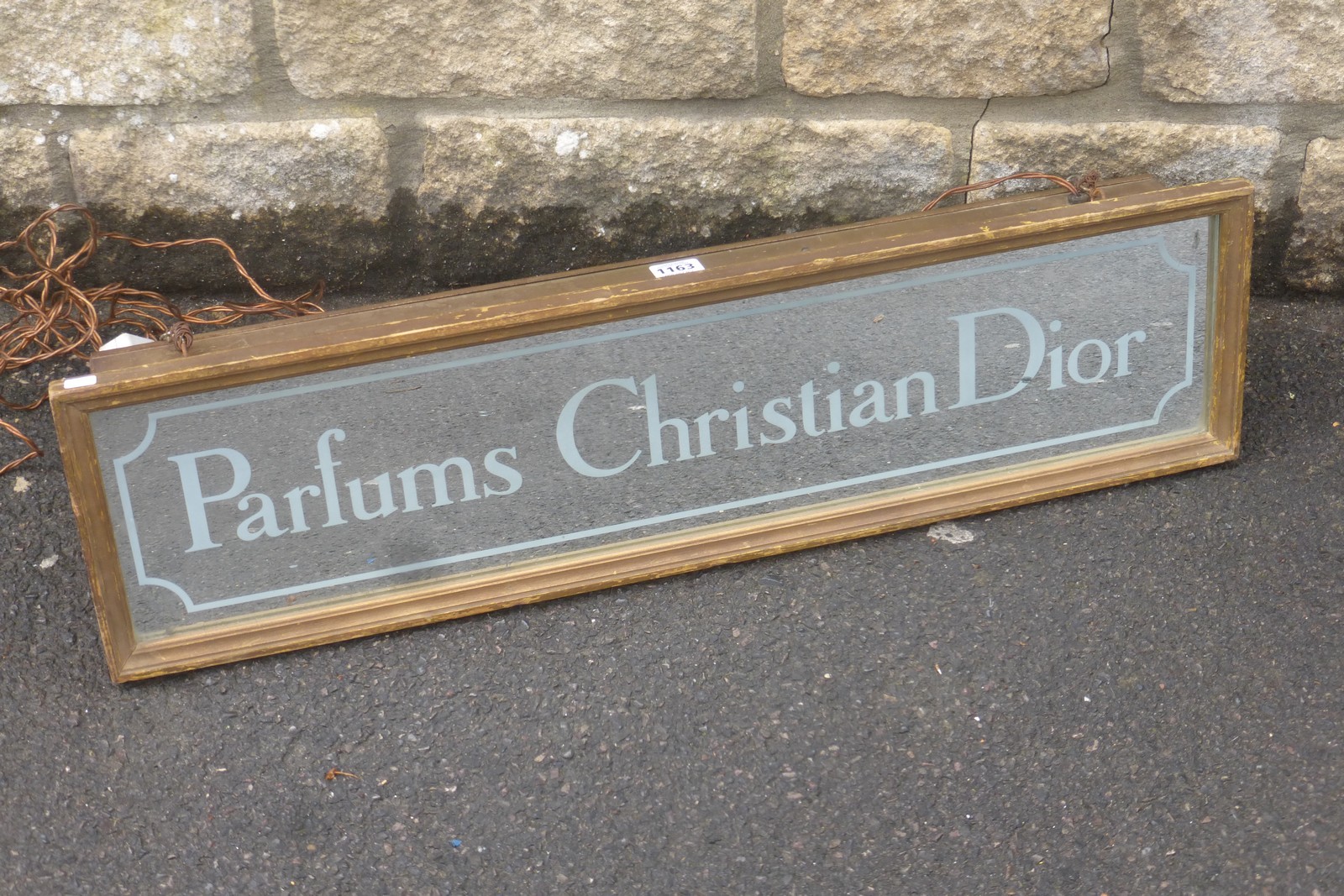 A rare Parfums Christian Dior illuminated lightbox, 29 1/2" wide x 4" deep x 7 3/4" high.