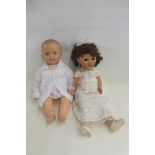 Two large plastic dolls.