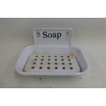 An enamel wall hanging soap dish.