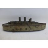 An early clockwork tinplate WWI battleship.