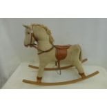 A cord covered rocking horse.