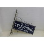 A double sided enamel sign - You may telephone from here, in excellent condition, set within a metal