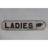An aluminium directional sign for Ladies, 24 x 5 1/4".