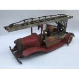 A clockwork tinplate model of a fire engine, possibly Mettoy.