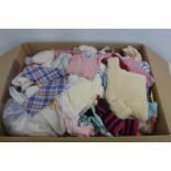 A quantity of dolls clothes.