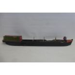 A scale model of a barge carrying a load of coal.