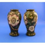 A pair of Moorcroft pottery green ground Vases, tubeline decorated in the Gustavia Augusta design by