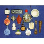 A collection of nine Oriental Snuff Bottles, including glass, ceramic, erotic etc., together with