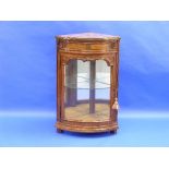 A French walnut bow-front corner display Case, the marble top above a frieze drawer and glazed door