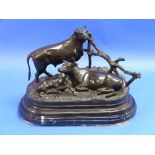 After Jules Moigniez (French, 1835-1894): a bronze figural group of cattle, comprising a bull, cow